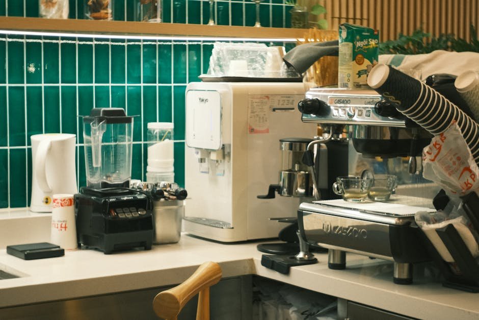 A bustling cafe counter showcasing espresso machines and blenders, perfect for a coffee shop theme.
