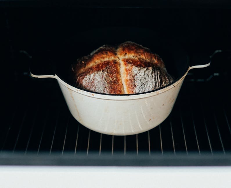 Crusty homemade bread in a Dutch oven inside an oven, perfectly baked for gourmet taste.